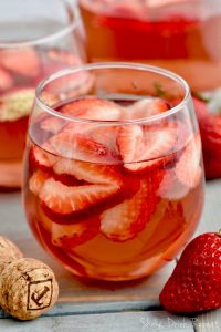 This Rose Sangria recipe with vodka is the perfect easy drink for a party or get together. This sparkling rose sangria is the perfect party drink!