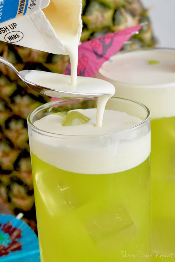 This Midori Splice cocktail is the perfect tropical drink made with just four ingredients!