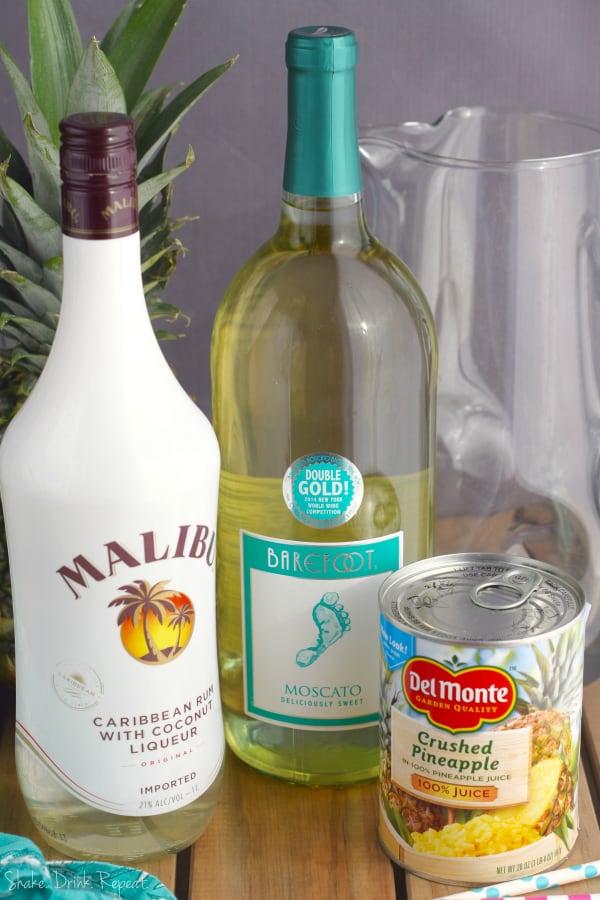 This easy Pina Colada Sangria Recipe comes together with only three ingredients! It is the perfect party drink! Make a double batch because it is that good!