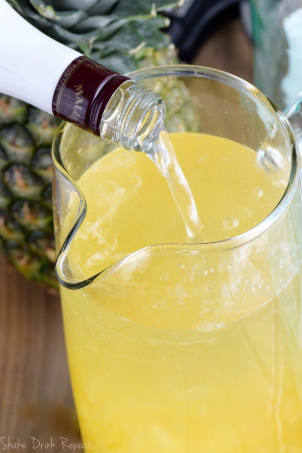 This easy Pina Colada Sangria Recipe comes together with only three ingredients! It is the perfect party drink! Make a double batch because it is that good!