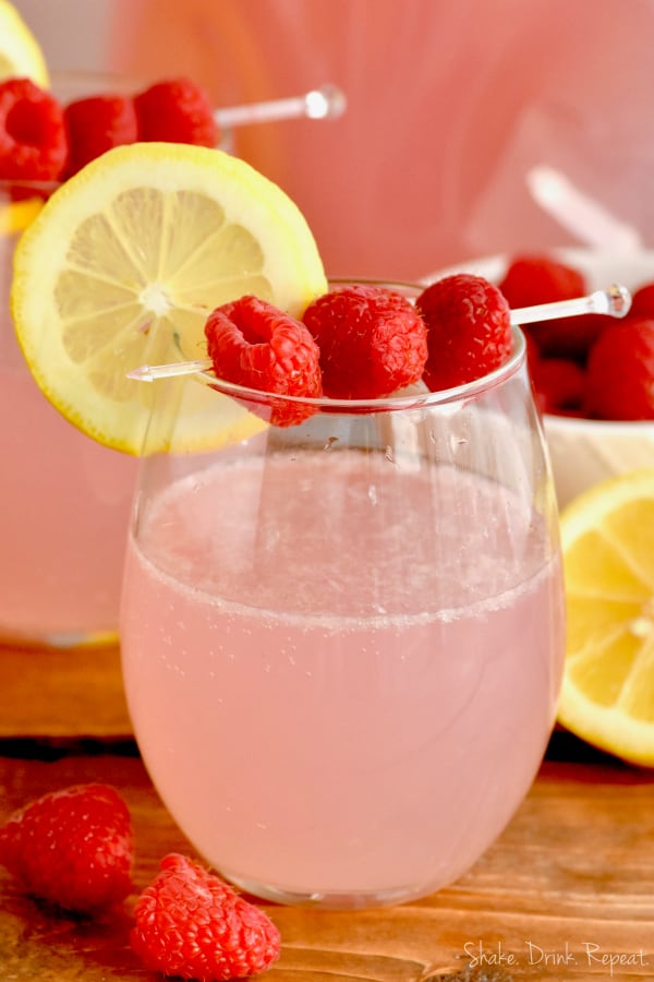 This Pink Lemonade Vodka Punch recipe is only three ingredients!! It is so easy and perfect for a party!