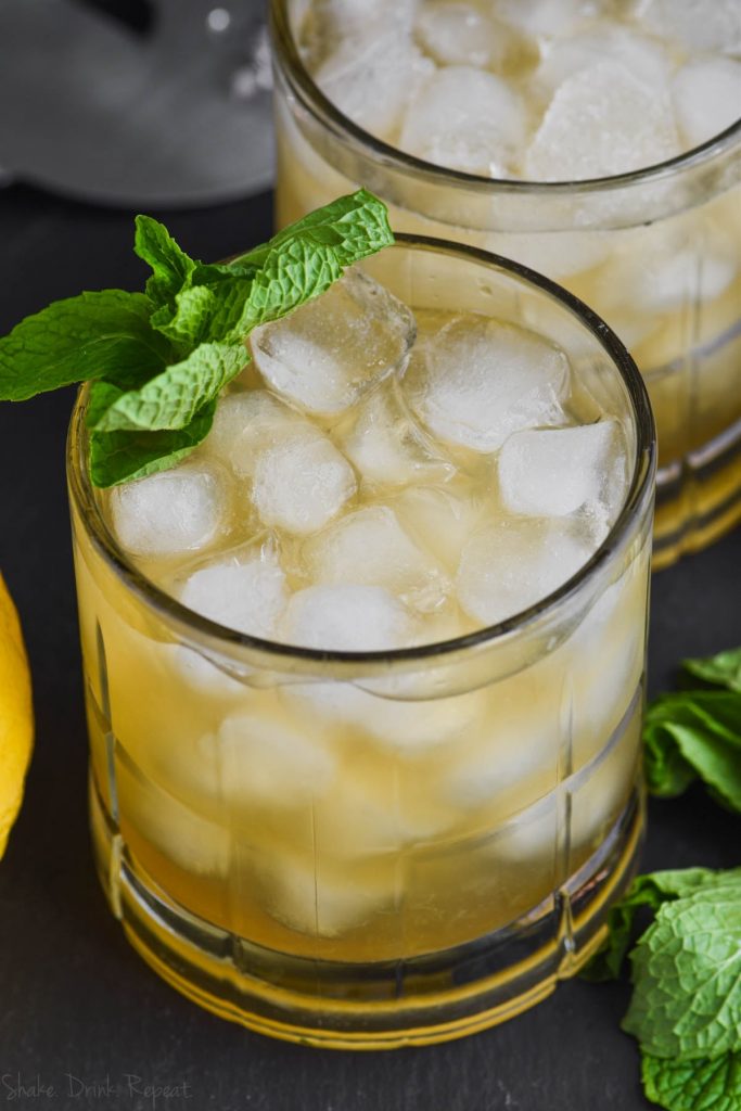 a whiskey smash cocktail recipe garnished with mint