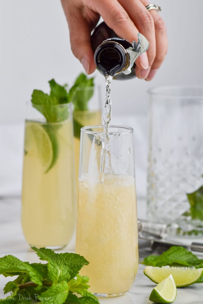 moscow mule in champagne glass being topped with champagne