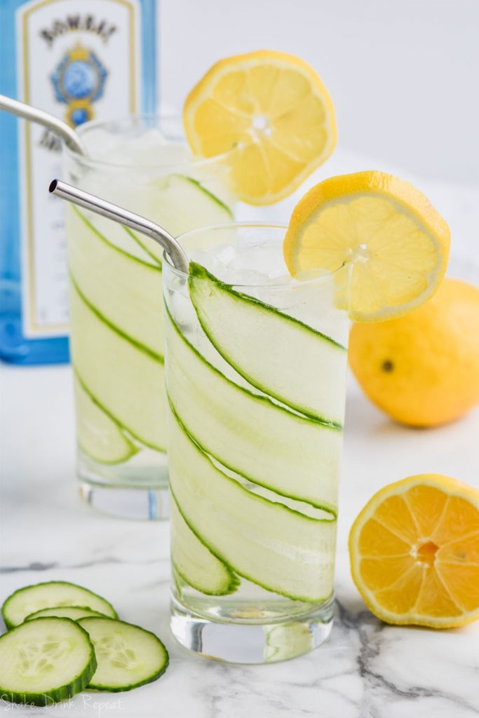 cucumber lemon gin and tonic in tall glass lined with sliced cucumber