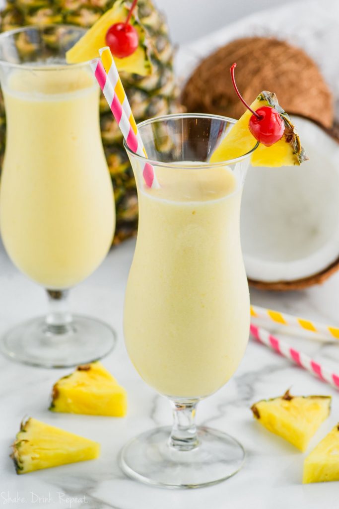 two hurricane glasses filled with easy pina colada recipe