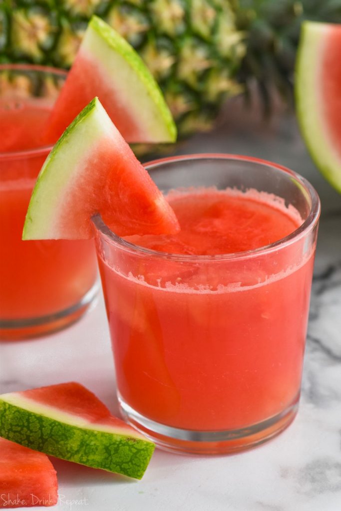 glass of watermelon rum punch with watermelon garnish