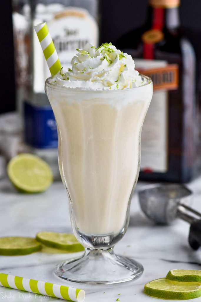 margarita milkshake recipe with alcohol bottles in the background