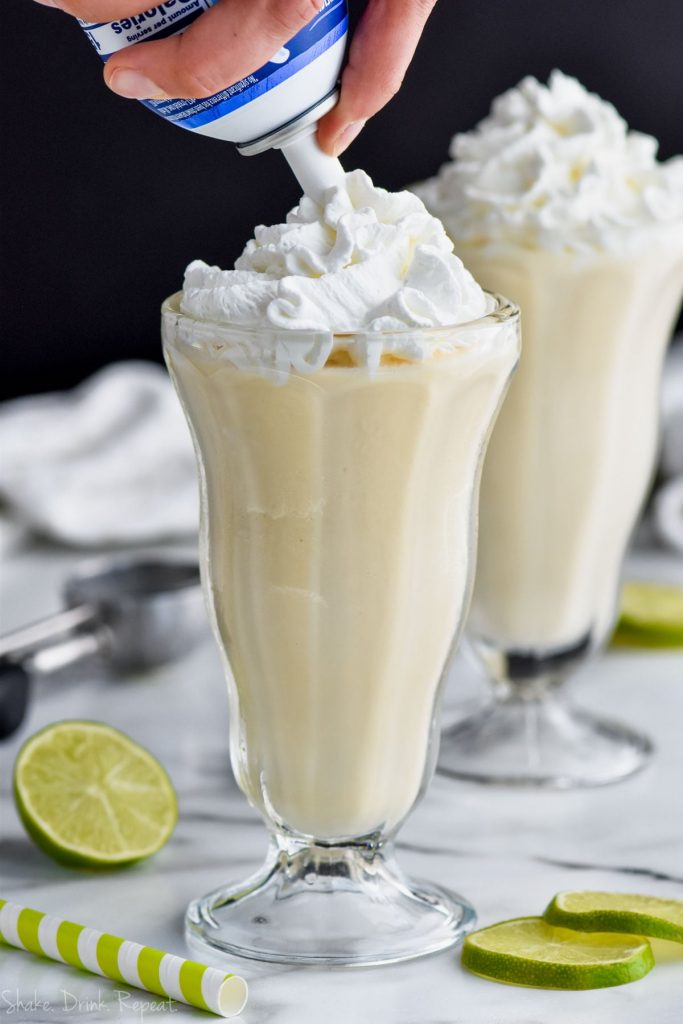 Toping in a margarita milkshake recipe with whipped cream