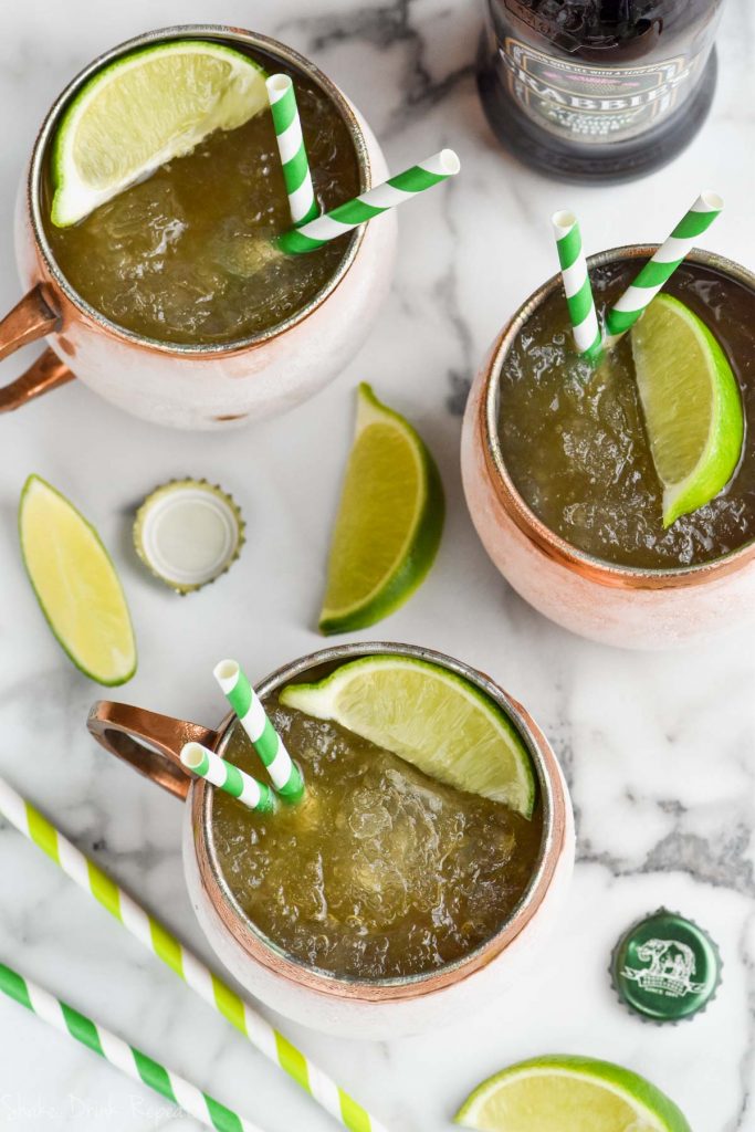 overhead view of three copper mugs with moscow mule slush