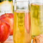 champagne glass of easy bellini recipe, apple pie bellini