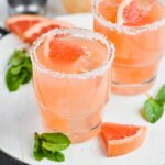 Salty Dog is glass with mint and grapefruit garnish