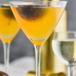 Two glasses of passion fruit drink and a glsss of Prosecco with passion fruit garnishment