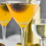 Two glasses of passion fruit drink and a glsss of Prosecco with passion fruit garnishment