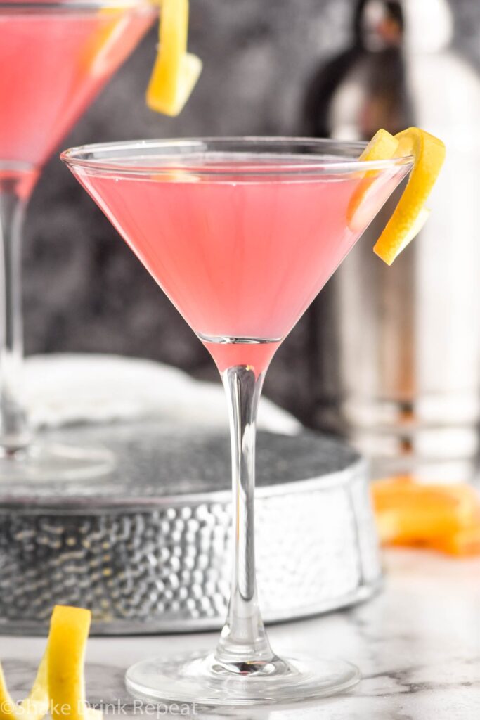 Cosmopolitan Cocktail in a glass garnished with a lemon twist