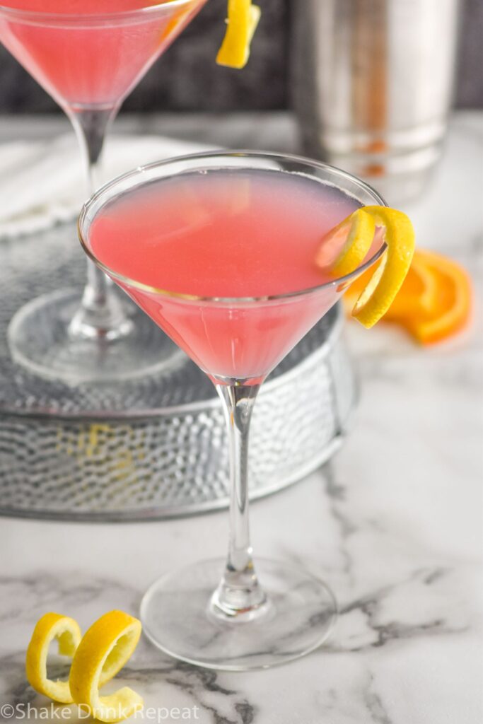 Cosmopolitan Cocktail in a glass garnished with a lemon twist