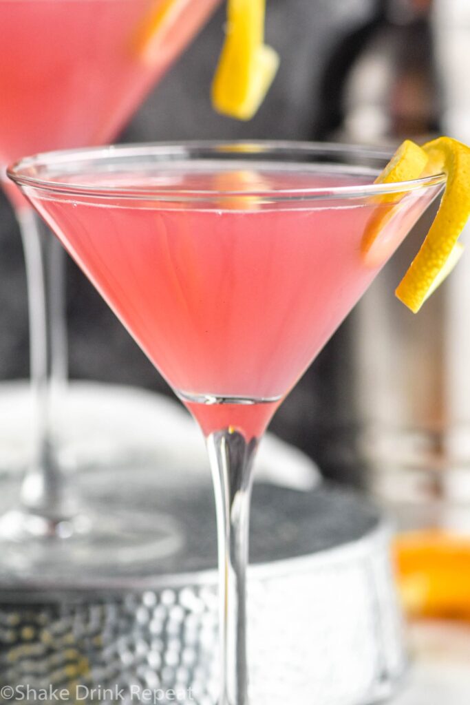 Cosmopolitan Cocktail in a glass garnished with a lemon twist