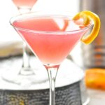 Cosmopolitan Cocktail in a glass garnished with a lemon twist