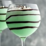 Grasshopper drink in glass with whipped cream and chocolate