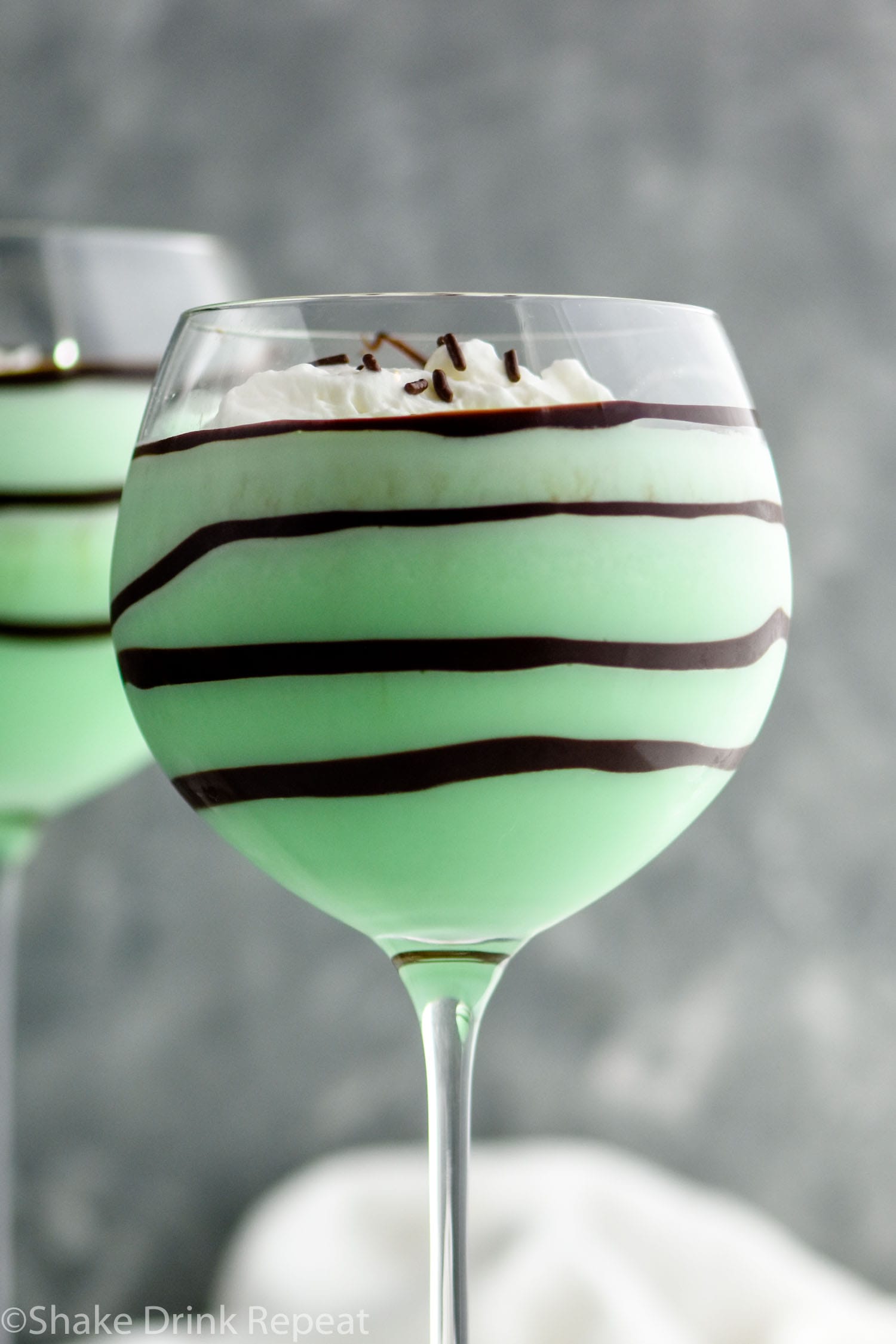 Grasshopper drink in glass with whipped cream and chocolate