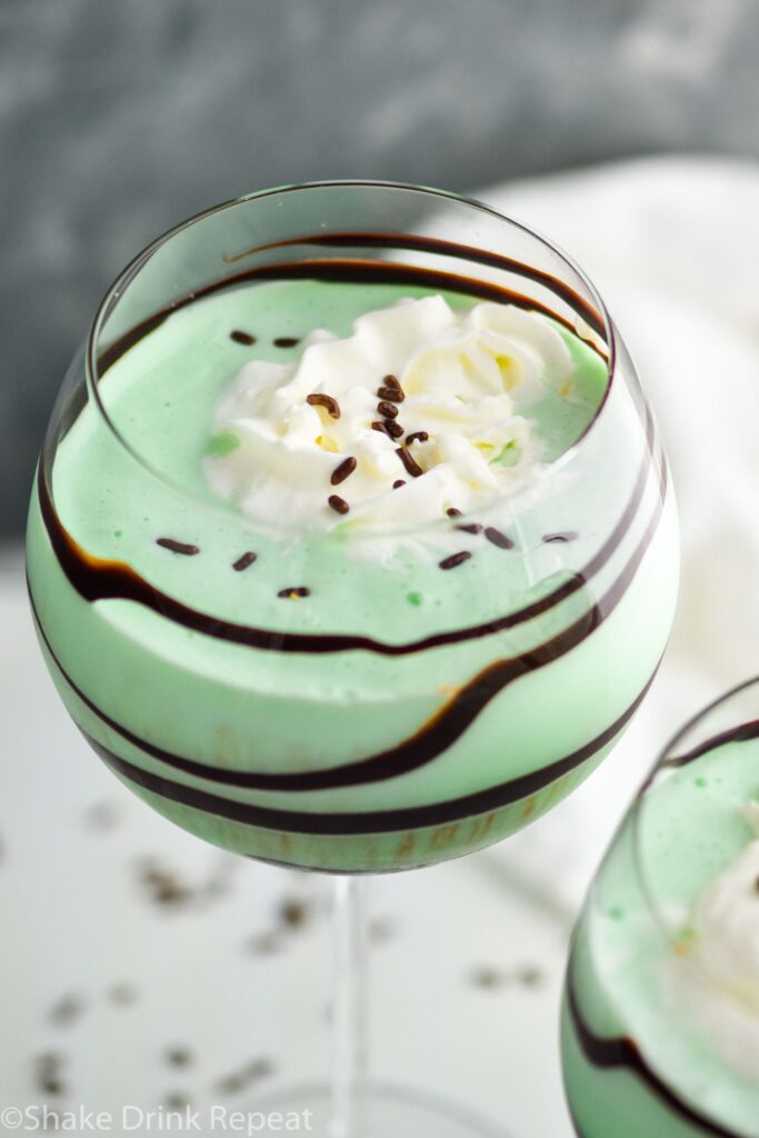 Grasshopper drink in glass with whipped cream and chocolate