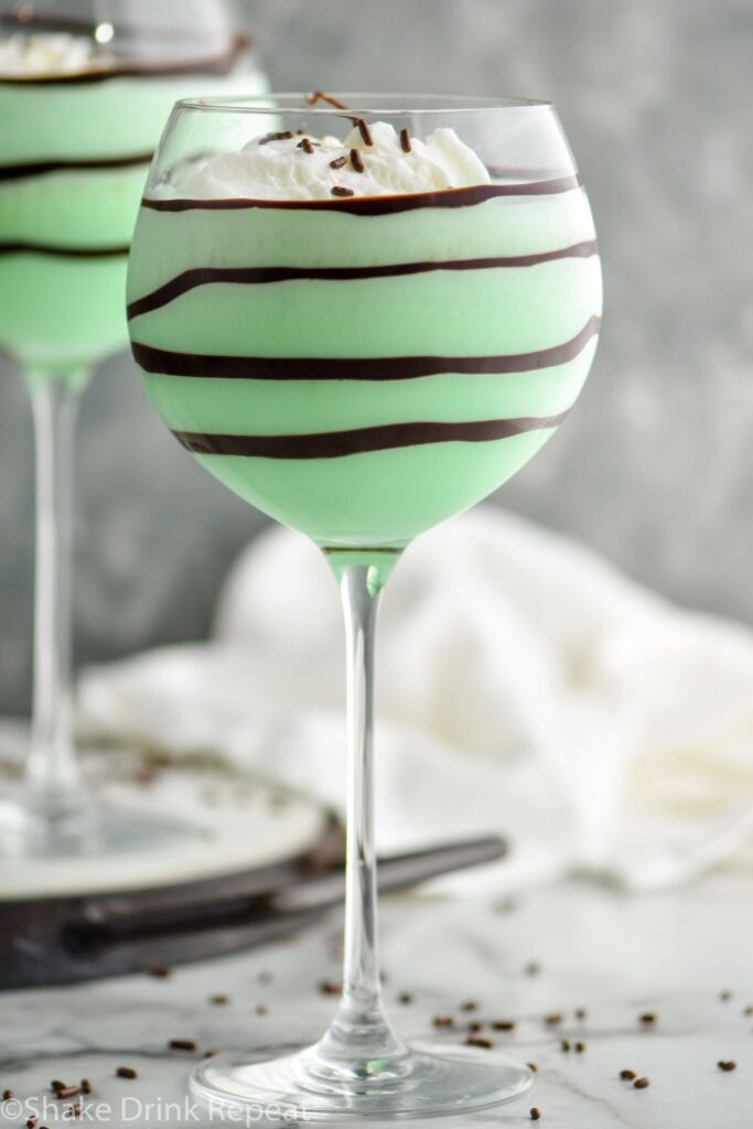 Grasshopper drink in glass with whipped cream and chocolate