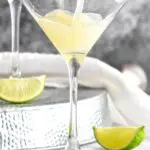 Kamikaze Drink poured into martini glass with lime wedge garnish