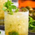 glass of mint julep recipe with shaved ice and fresh mint leaves garnish