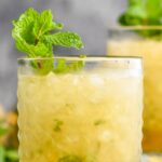glass of mint julep with shaved ice and fresh mint leaves