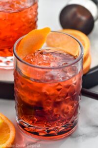 glass of Negroni with ice and orange twist