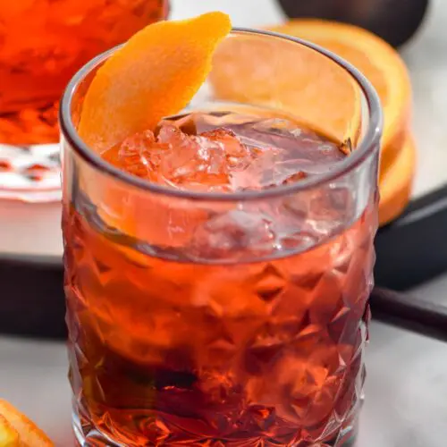 glass of Negroni with ice and orange twist