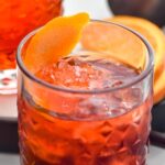 glass of Negroni with ice and orange twist