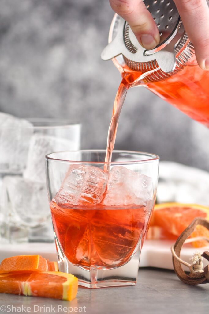 boulevardier recipe ingredients in glass with ice and orange garnish