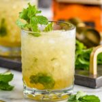 glass of mint julep cocktail with ice and bourbon