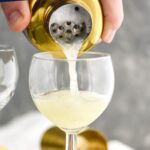 Gin Fizz recipe being poured into a glass