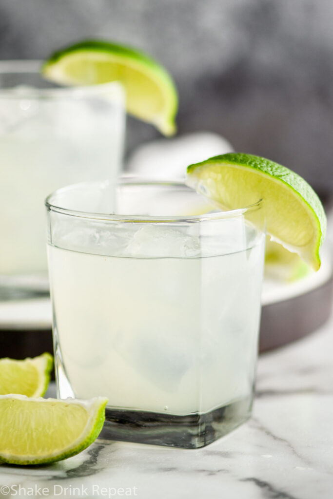 two glasses of vodka gimlet with ice and limes