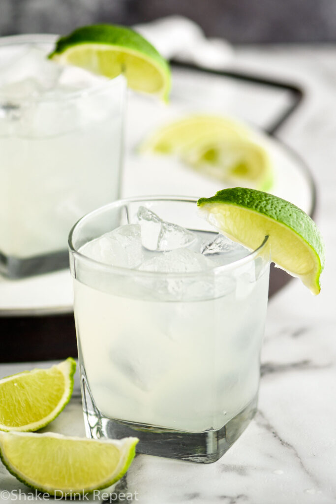 two glasses of vodka gimlet with ice and limes