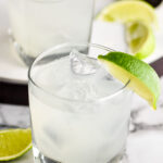 two glasses of vodka gimlet with ice and limes