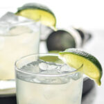 two glasses of vodka gimlet with ice and limes