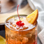 glass of wisconsin brandy old fashioned with ice, cherry, and orange