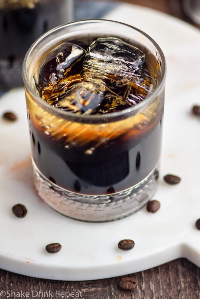 glass of mind eraser cocktail with ice and coffee beans