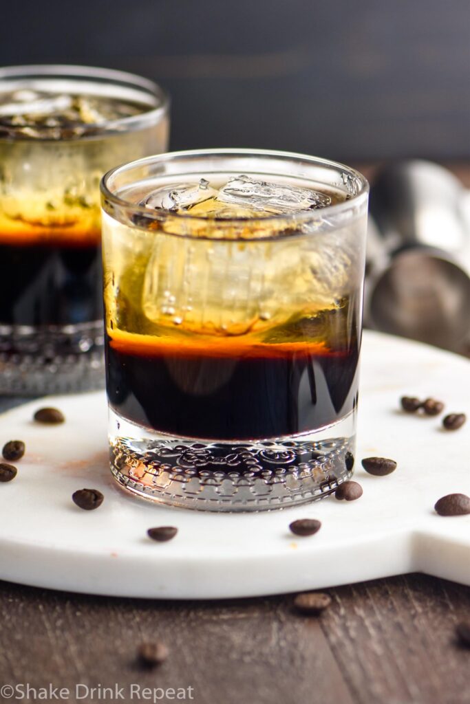 two glasses of mind eraser cocktails with ice and coffee beans