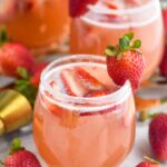 two glasses of strawberry margarita sangria with sugar coated rim