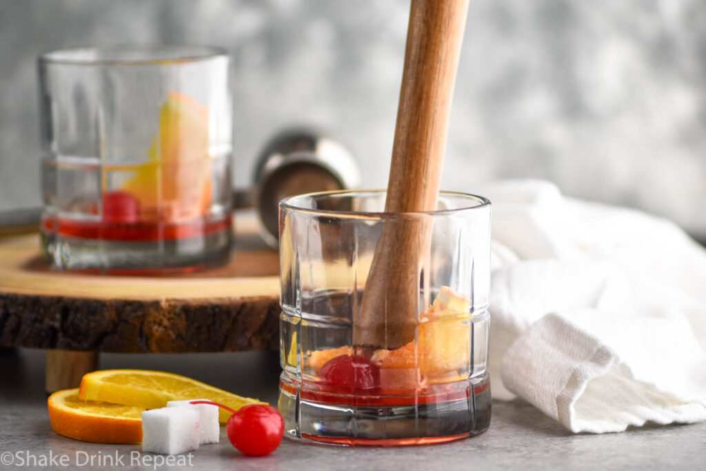 glass of muddled wisconsin old fashioned ingredients