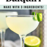 glass of daiquiri with a lime twist