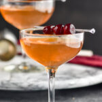 two glasses of Manhattan cocktail with cherry garnish