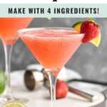 glass of strawberry daiquiri with fresh lime and strawberry garnish