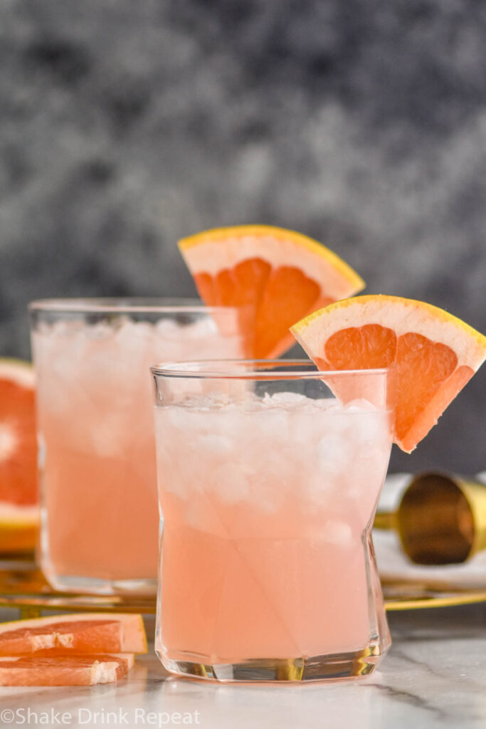 two glasses of paloma cocktail with crushed ice and grapefruit