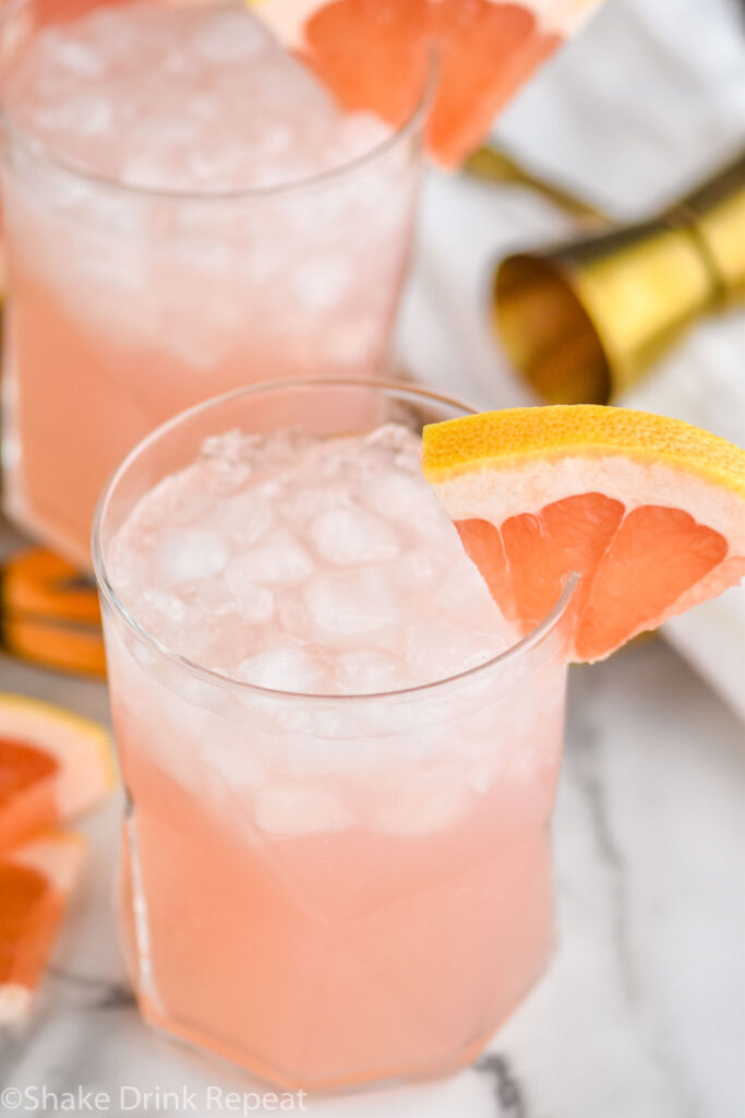 two glasses of paloma cocktail with crushed ice and grapefruit