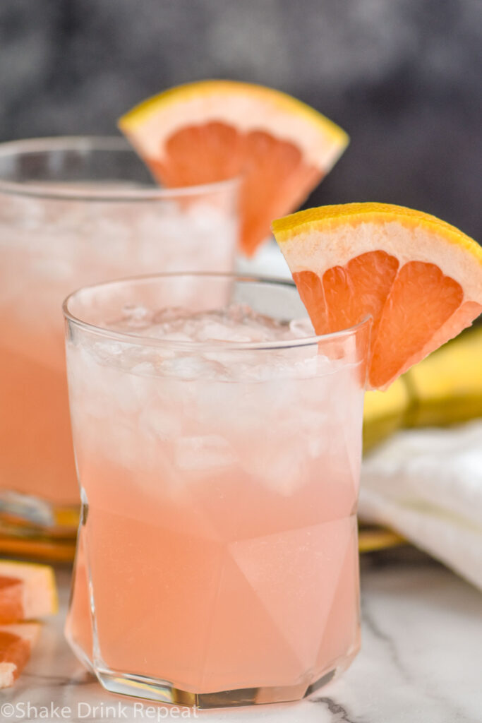 two glasses of Paloma cocktail with crushed ice and grapefruit