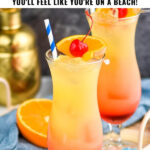 two glasses of bahama mama with ice, fresh orange slices, and cherry garnish surrounded by drink umbrella and straws